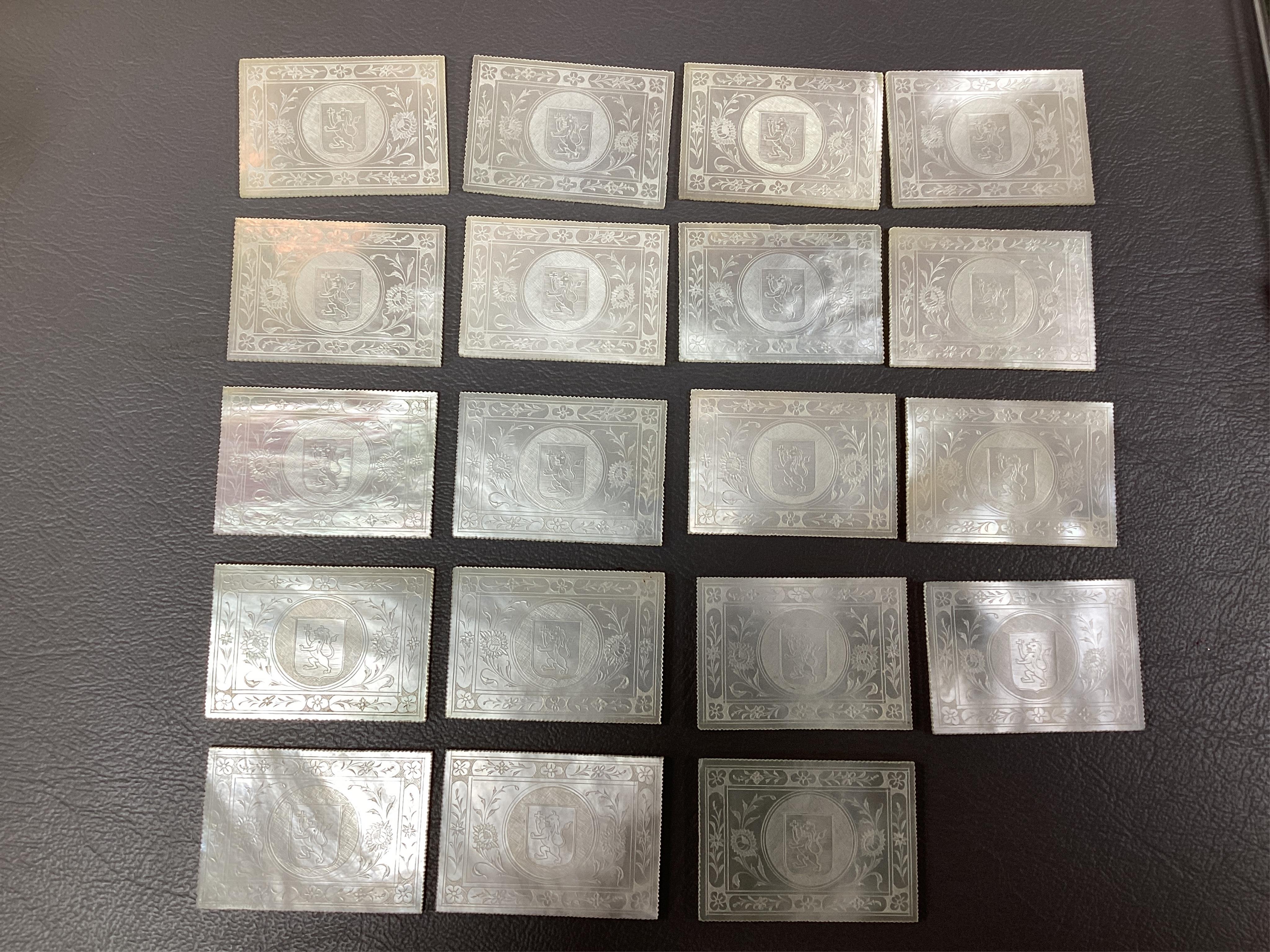 Two Chinese gilt decorated black lacquer games boxes, containing numerous mother-of-pearl counters, 19th century